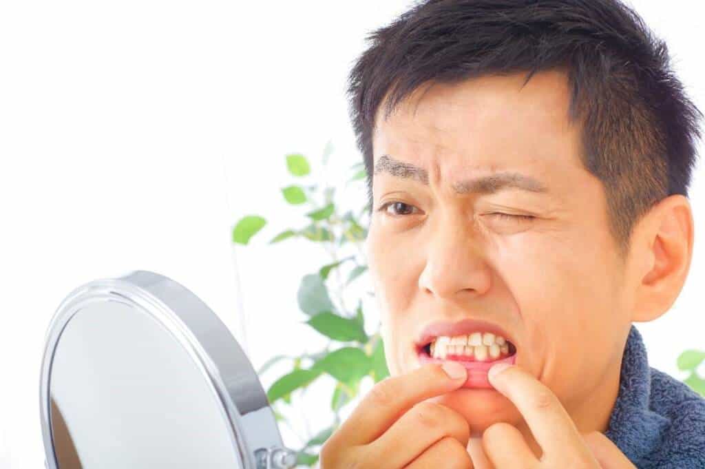 Elderly patient using Hong Kong healthcare voucher for professional dental scaling at a private clinic